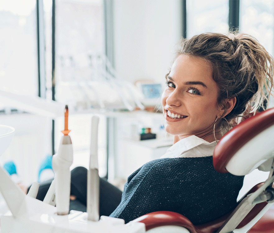 Woman smiling in dental chair.